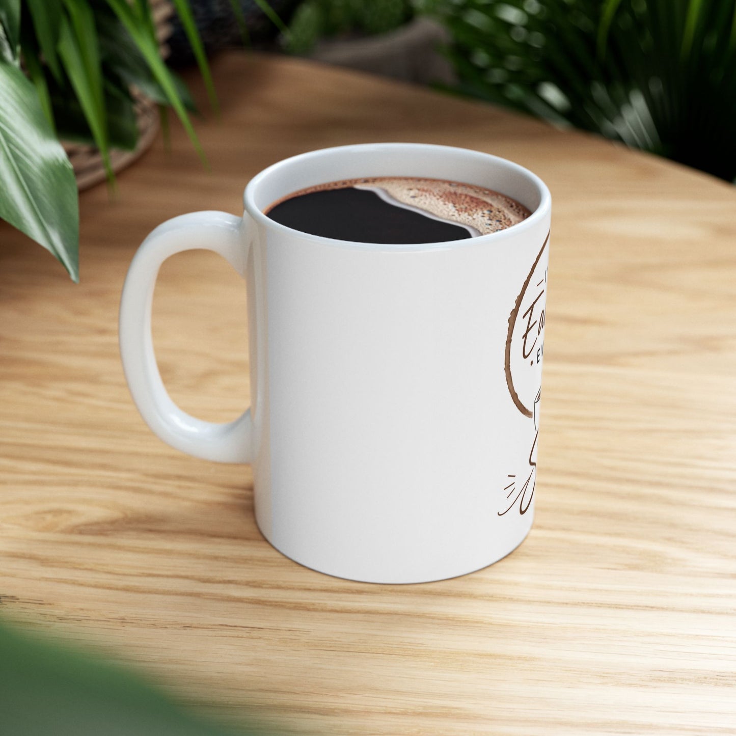 White coffee mug on wooden table with coffee and warm lighting showing I’ve Earned Every Sip minimalist design
