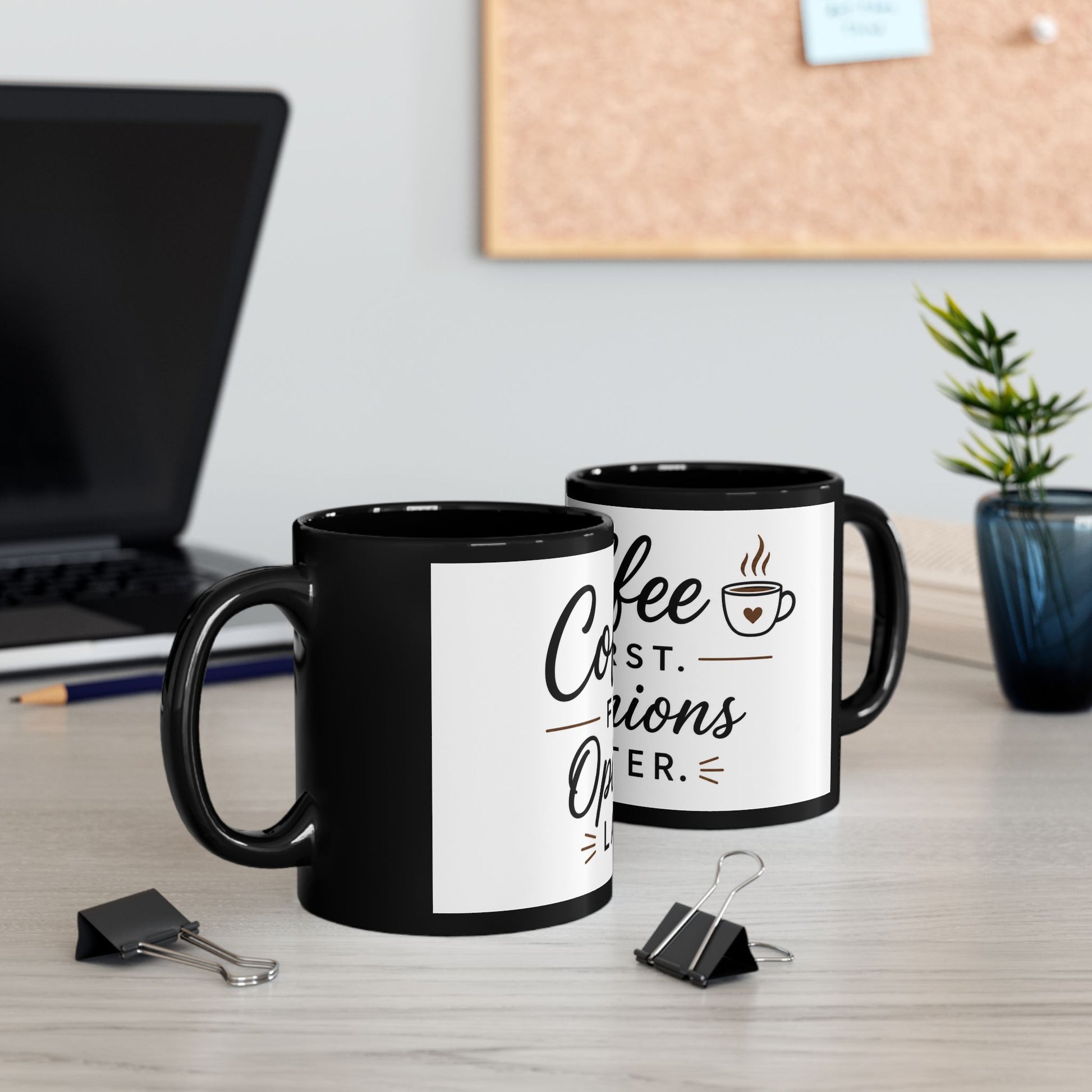Black coffee mug on wooden table with morning coffee setup showing Coffee First Opinions Later humorous quote design