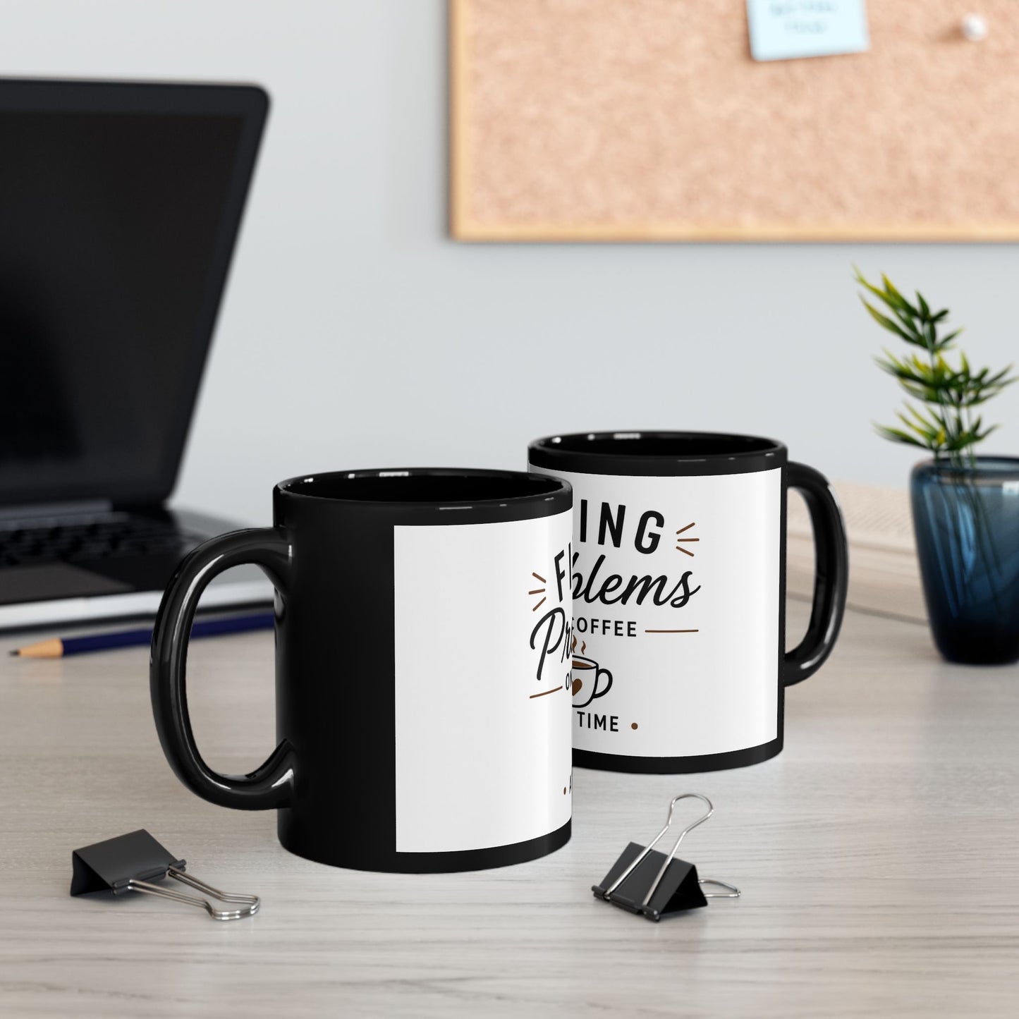 Two identical black coffee mugs with Fixing Problems One Coffee at a Time quote placed next to each other on desk with coffee setup
